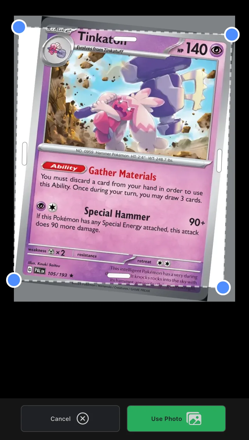 The crop review screen showing a detected card with four draggable corner handles
